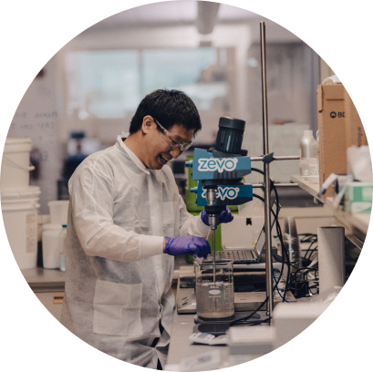 Male scientist conducting research and development on Zevo in-home insect control products in laboratory setting.